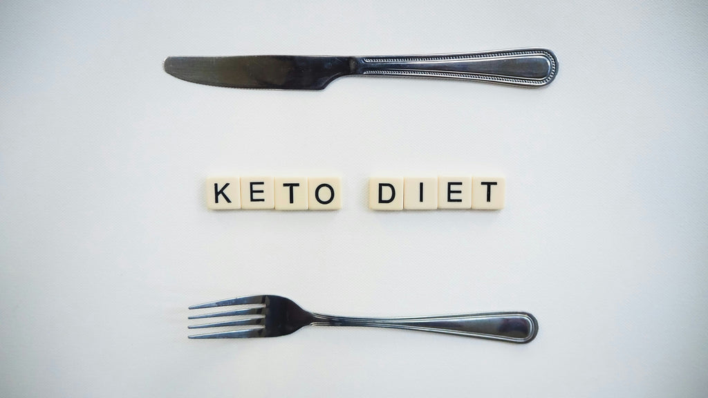 Keto Diet Spelled Out in Scrabble Letters Between a Fork and Knife